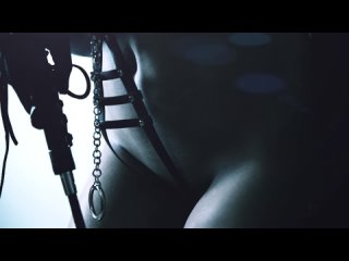 bdsm sexy mistress in a leather mask and harness with a whip (erotica, sex, beautiful girl, naughty model, striptease)